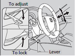 1. Push the steering wheel adjustment lever