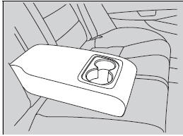 Pull down the armrest in the center seat-back.
