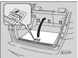 Pull the handle to open the cargo floor lid.