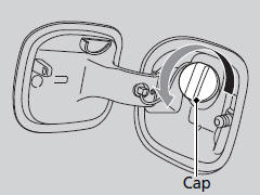 5. Remove the fuel fill cap slowly. If you hear a