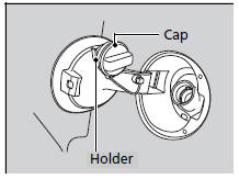 6. Insert the fuel filler nozzle fully.