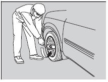 10. Loosen each wheel nut about one turn using the wheel nut wrench.
