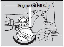 1. Unscrew and remove the engine oil fill cap.
