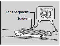 1. Remove the lens segment by prying on the edge using a flat-tip screwdriver.