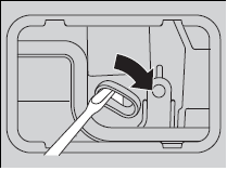 2. To open the tailgate, push the tailgate while pushing down the lever with